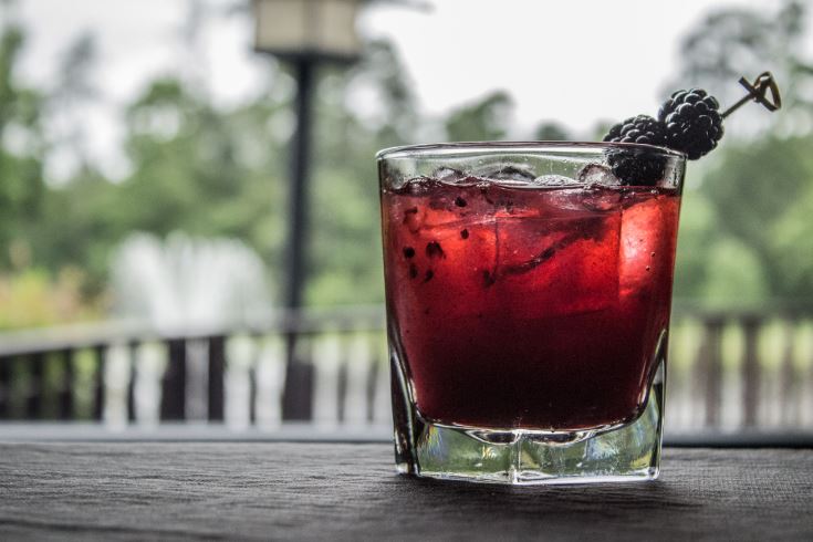 Bourbon Sinatra Smash Cocktail on outdoor table