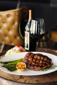 Rib eye steak with wine and Asparagus